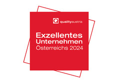 Rotes Logo mit weißer Schrift "Exzellentes Unternehmen Österreichs"